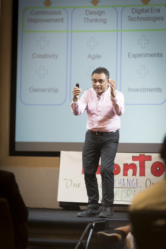 Jay Pandya speaking on stage